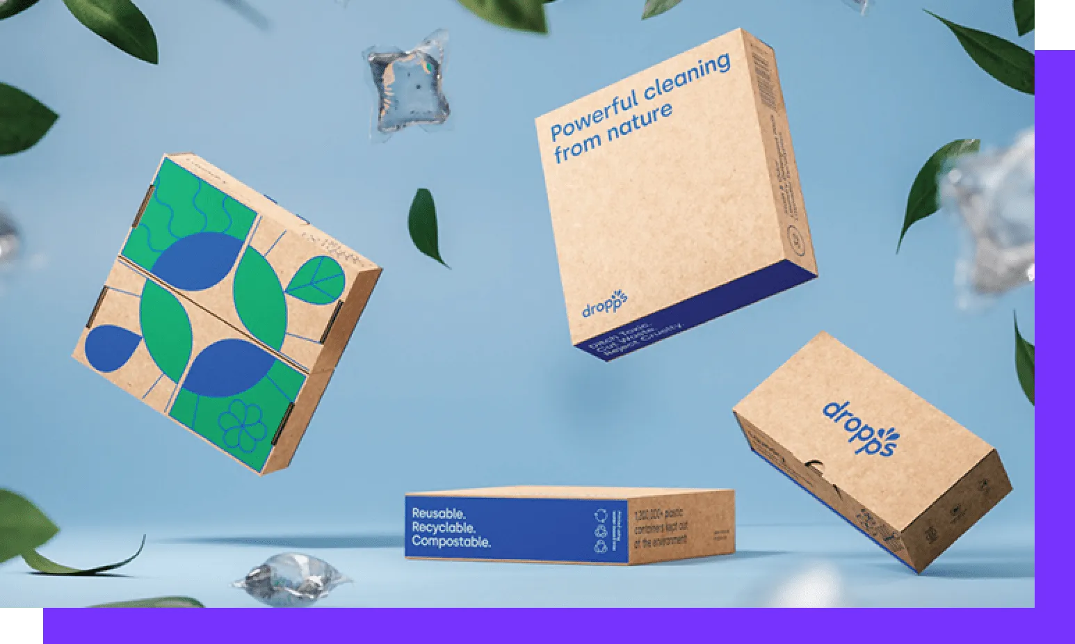Dropps eco-friendly detergent pod boxes floating among green leaves and water droplets
